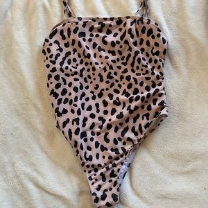 Pink and black cheetah body suit